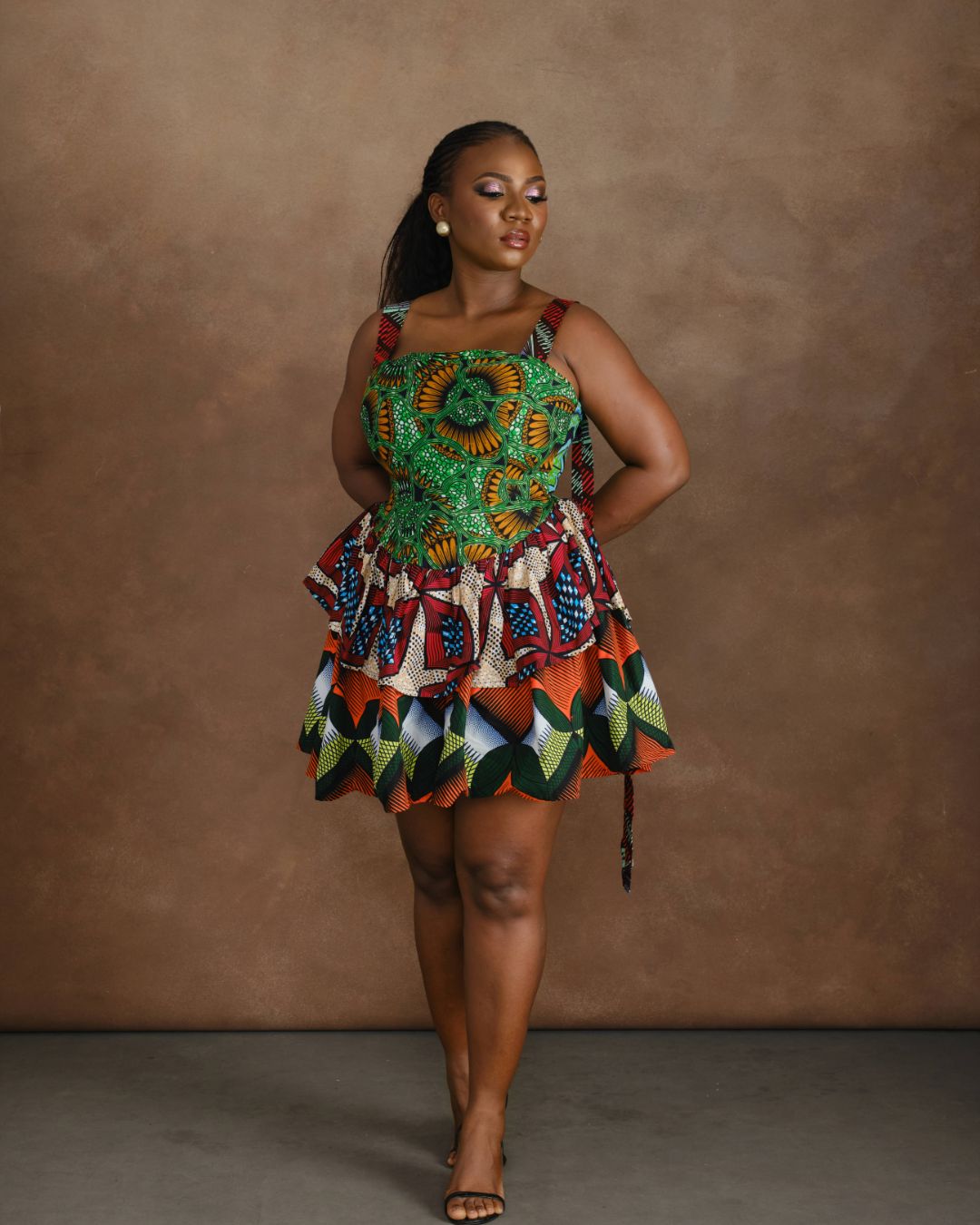 Woman wearing a vibrant ankara mini dress